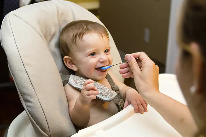 Child being fed with spoon